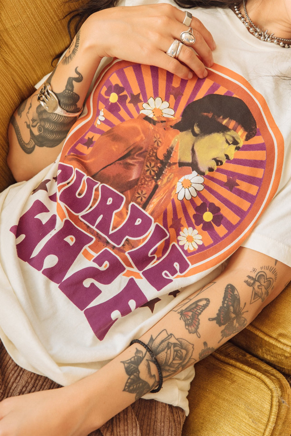 White Jimi Hendrix Purple Haze Tee featuring a vibrant graphic of Jimi Hendrix, made from 100% organic cotton.