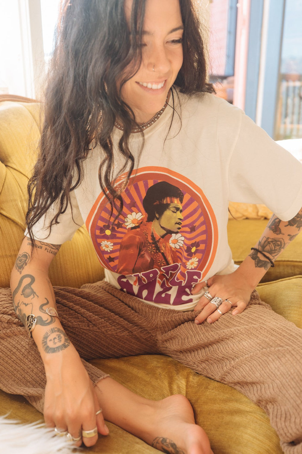 White Jimi Hendrix Purple Haze Tee featuring a vibrant graphic of Jimi Hendrix, made from 100% organic cotton.