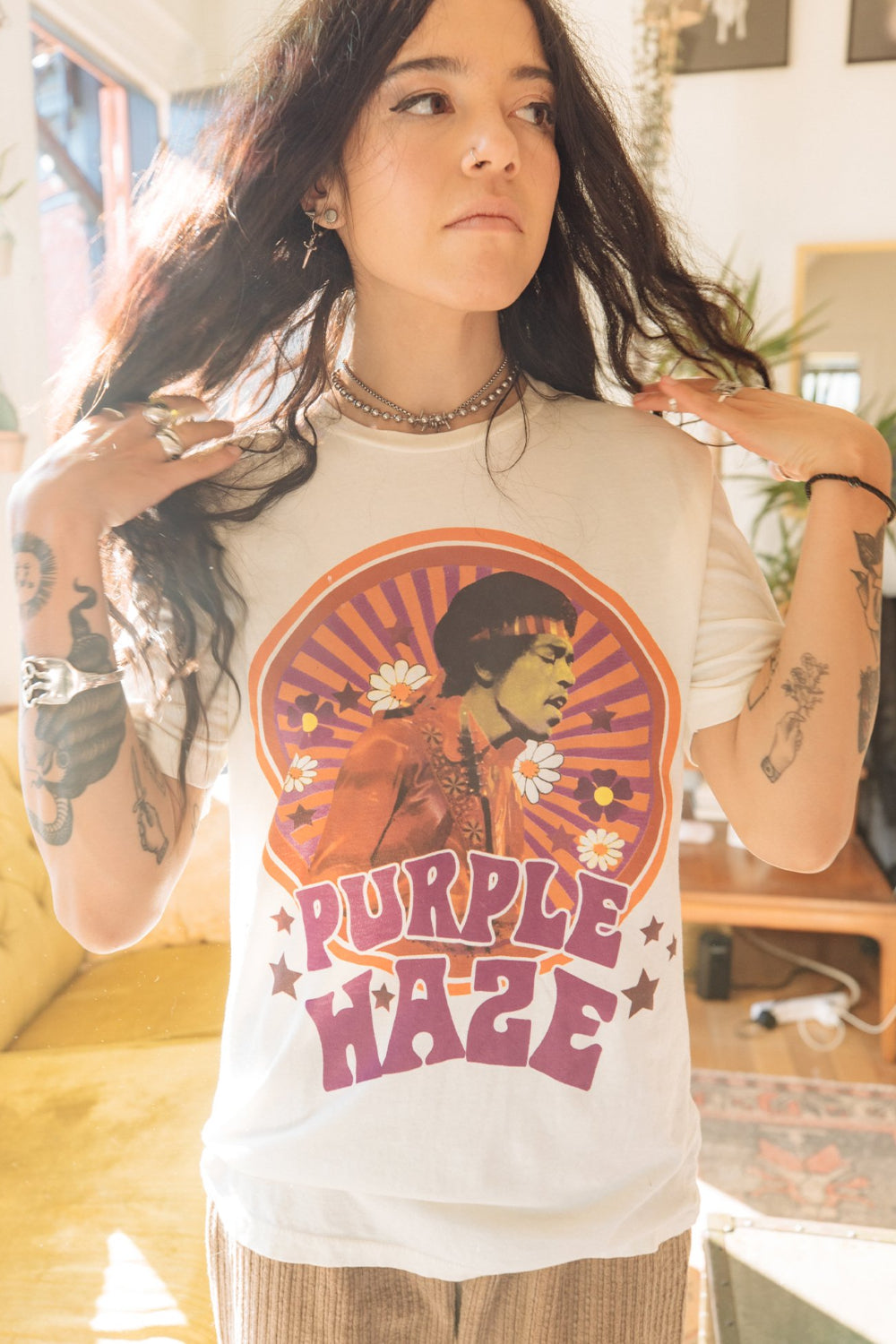 White Jimi Hendrix Purple Haze Tee featuring a vibrant graphic of Jimi Hendrix, made from 100% organic cotton.