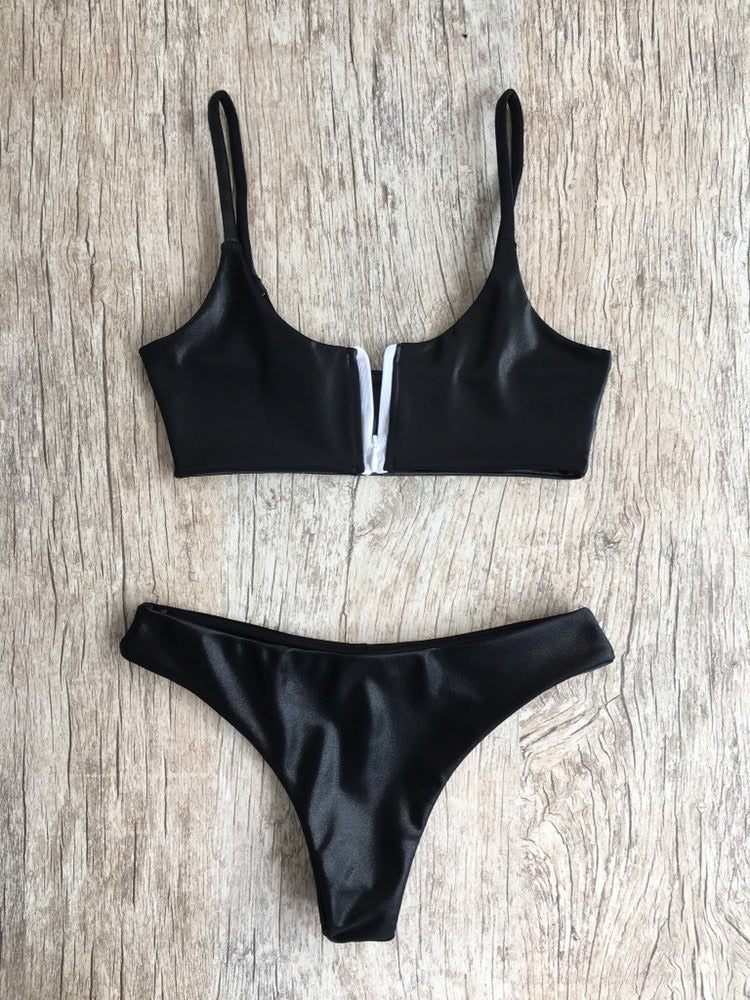 JONES BOTTOMS in faux leather, featuring a cheeky cut and zip-up fastening, perfect for stylish swimwear.