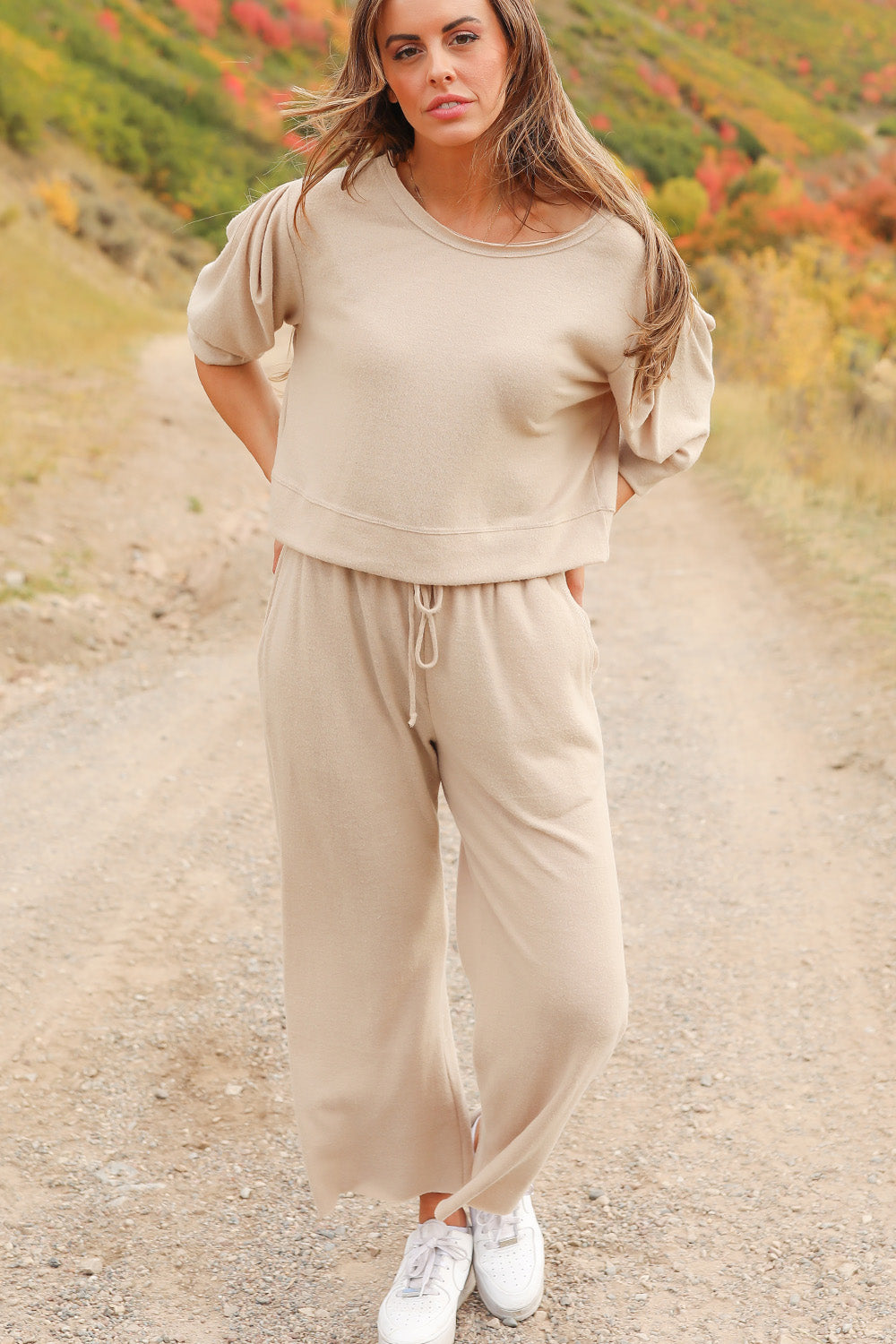 A pair of Journey Pants in brown, featuring a slouchy fit, cropped length, and drawstring waist, with pockets visible.