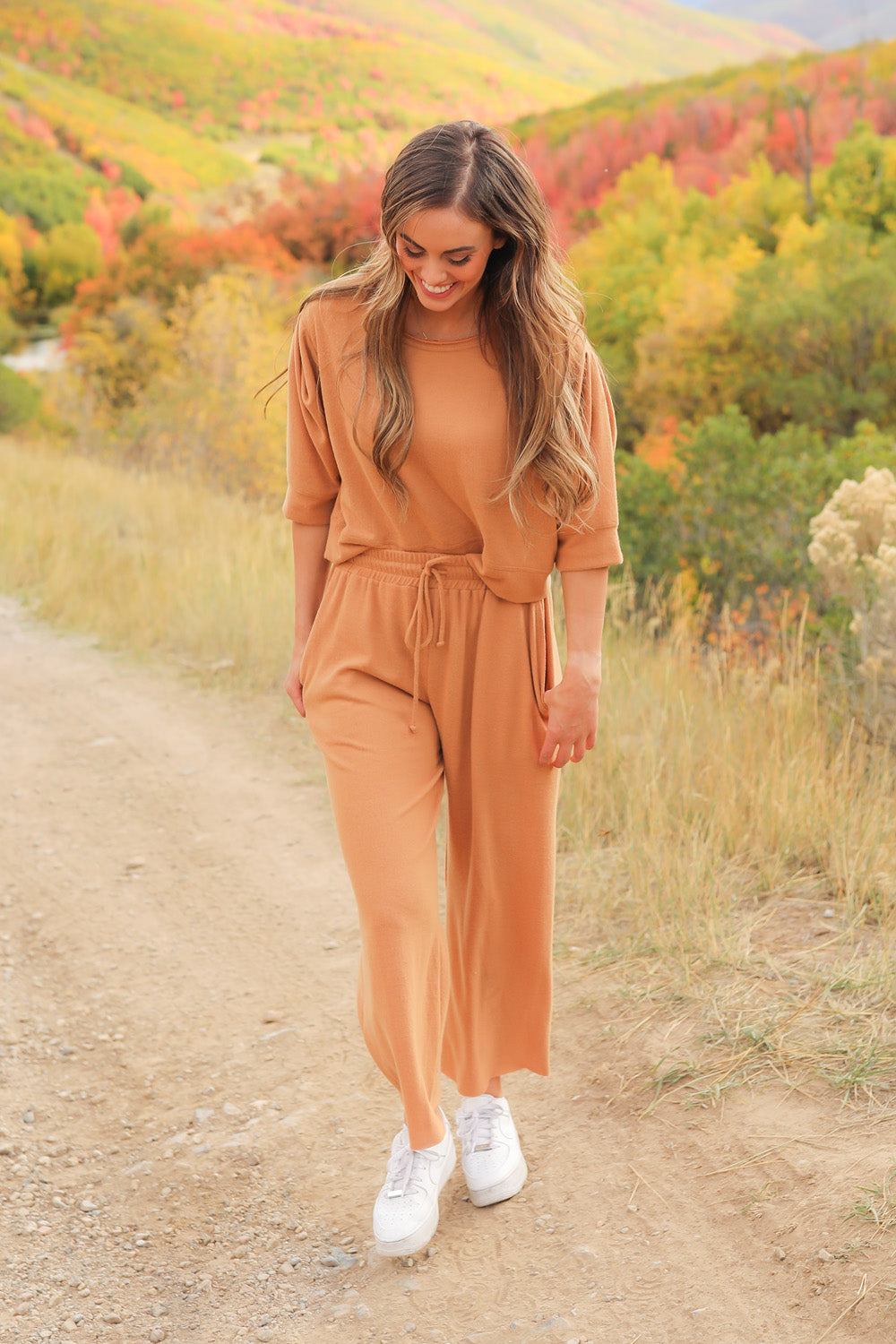 A pair of Journey Pants in brown, featuring a slouchy fit, cropped length, and drawstring waist, with pockets visible.