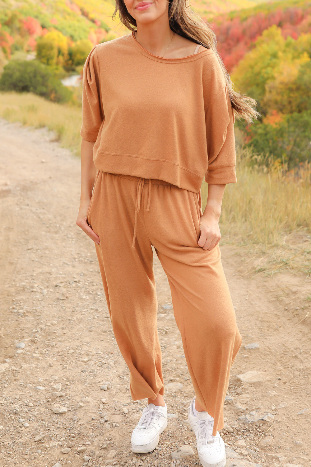 A pair of Journey Pants in brown, featuring a slouchy fit, cropped length, and drawstring waist, with pockets visible.