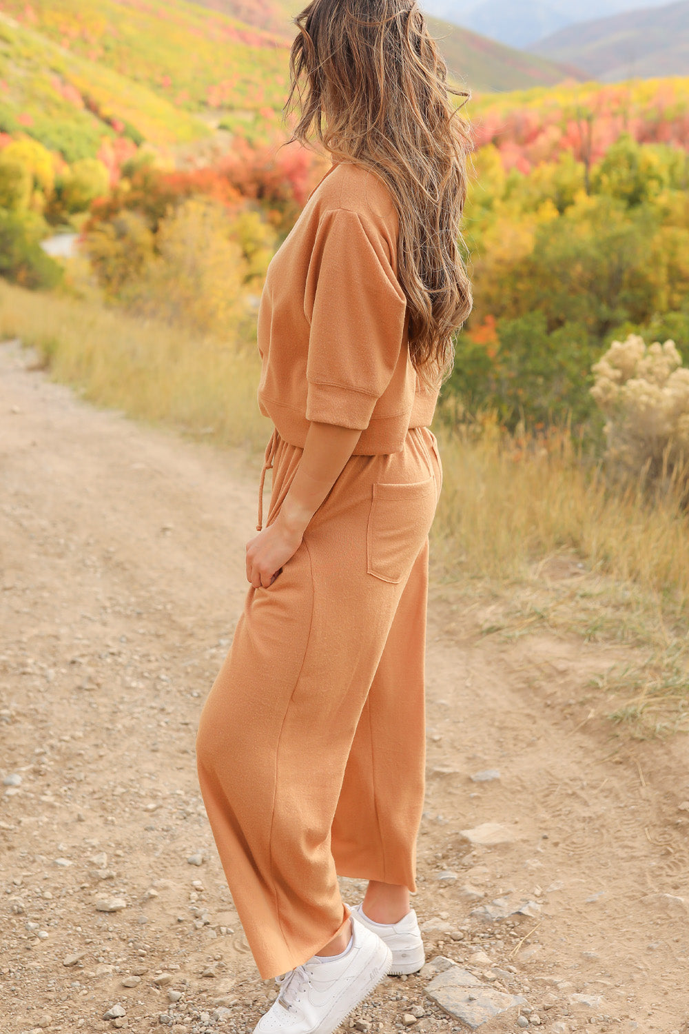 A pair of Journey Pants in brown, featuring a slouchy fit, cropped length, and drawstring waist, with pockets visible.