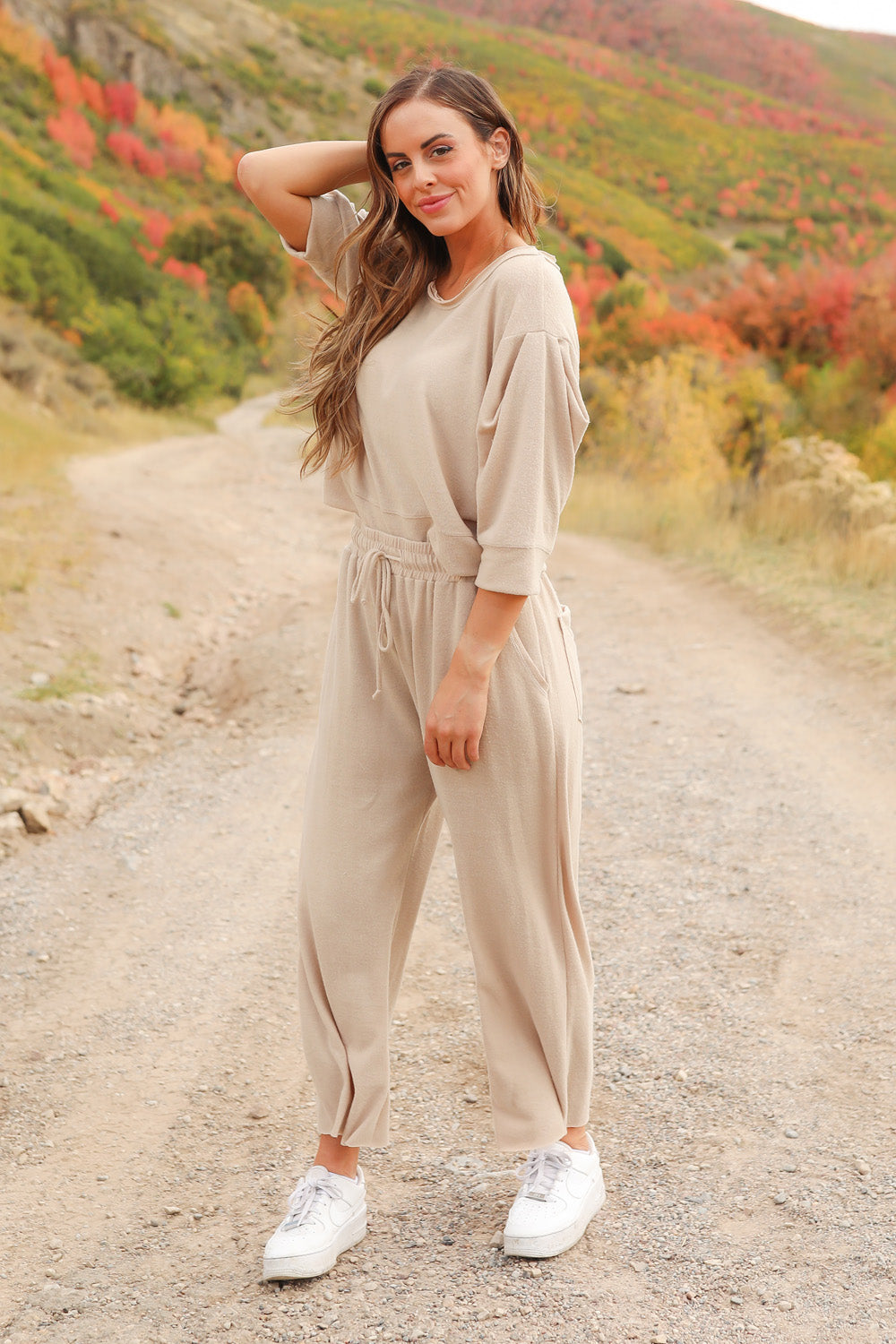 A pair of Journey Pants in brown, featuring a slouchy fit, cropped length, and drawstring waist, with pockets visible.