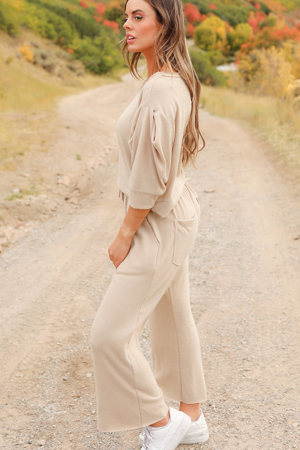 A pair of Journey Pants in brown, featuring a slouchy fit, cropped length, and drawstring waist, with pockets visible.