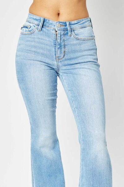 Judy Blue Full Size Mid Rise Raw Hem Slit Flare Jeans showcasing a light wash with a stylish raw hem and slit flare design.