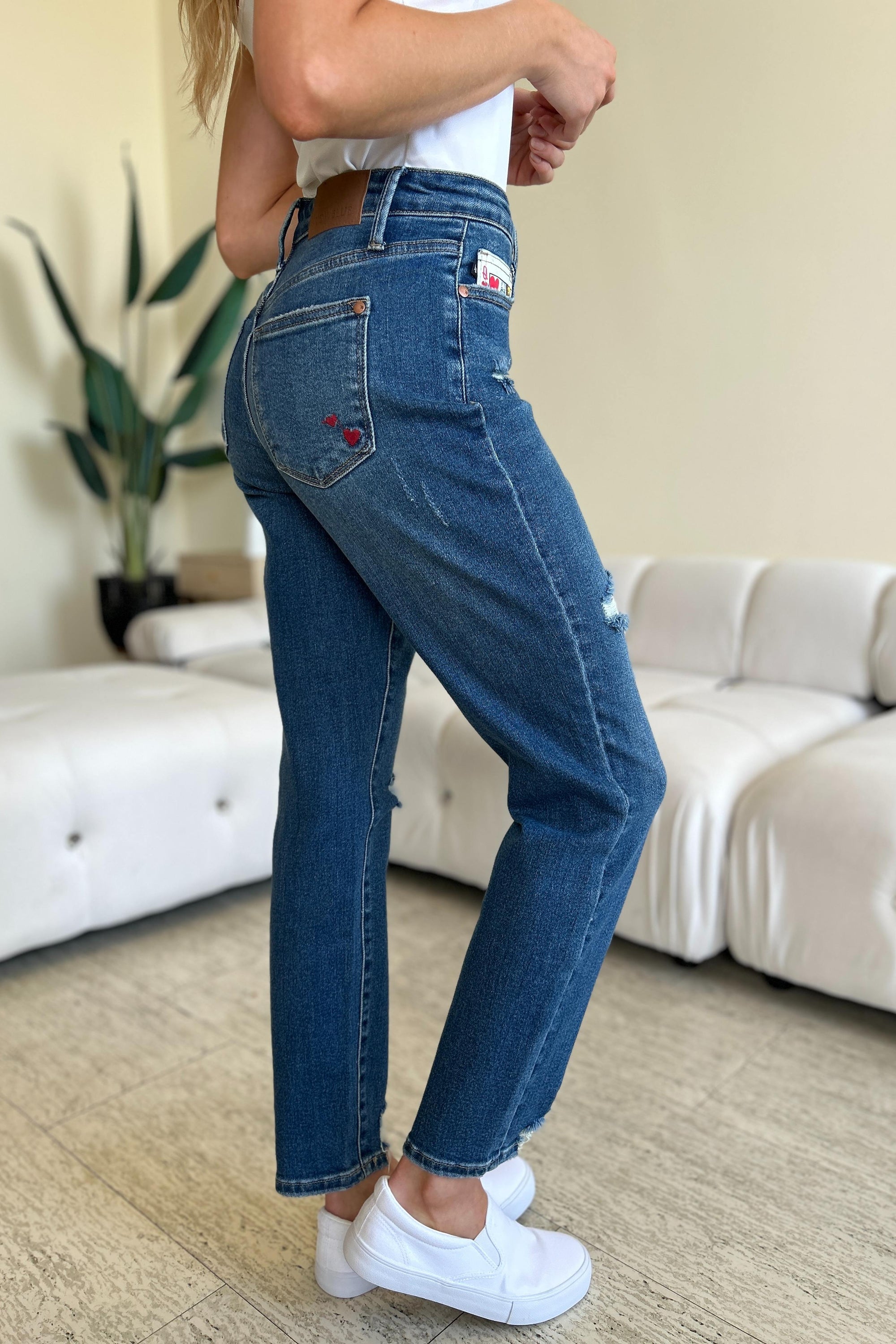 Judy Blue Full Size Queen Of Hearts Coin Pocket BF Jeans featuring a trendy distressed design and comfortable boyfriend fit.