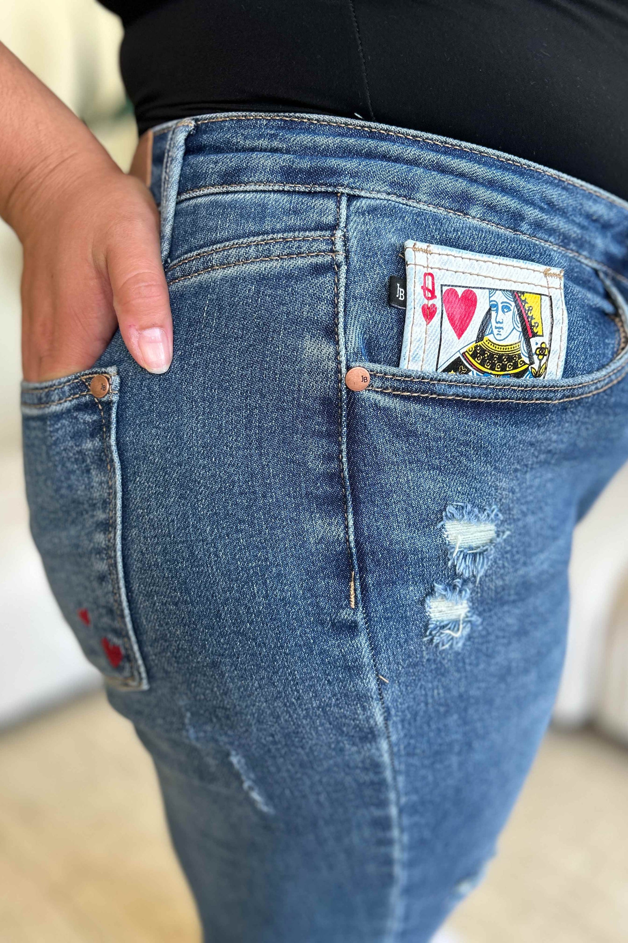 Judy Blue Full Size Queen Of Hearts Coin Pocket BF Jeans featuring a trendy distressed design and comfortable boyfriend fit.