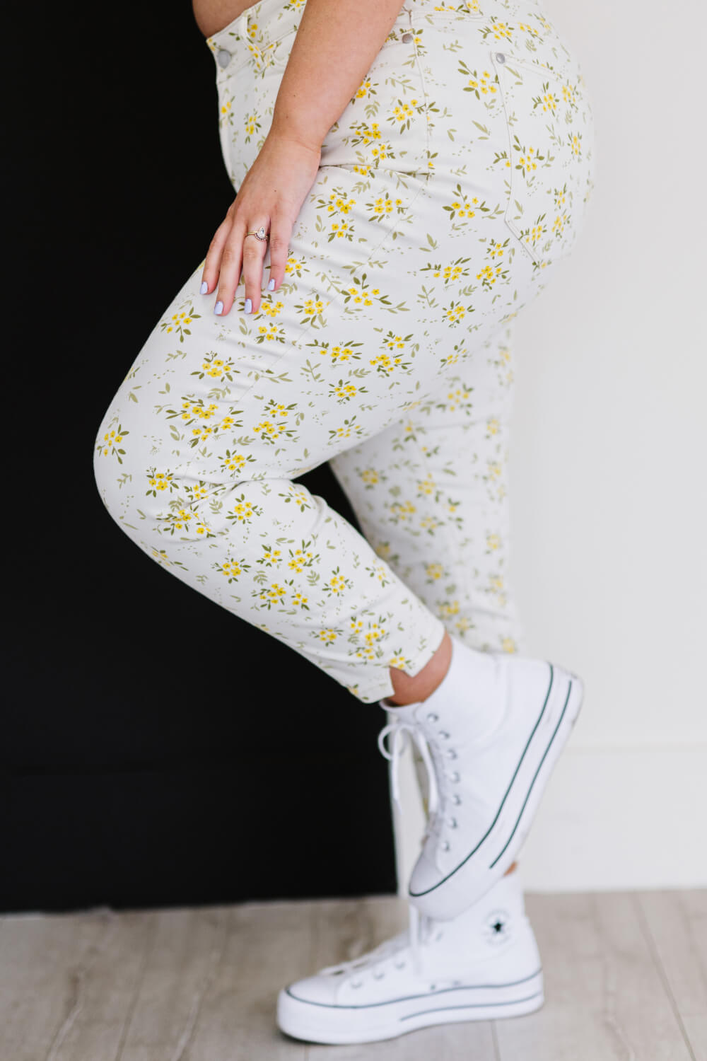 Judy Blue Golden Meadow Floral Skinny Jeans featuring a vibrant yellow floral pattern, mid-rise waist, and a slim fit design.