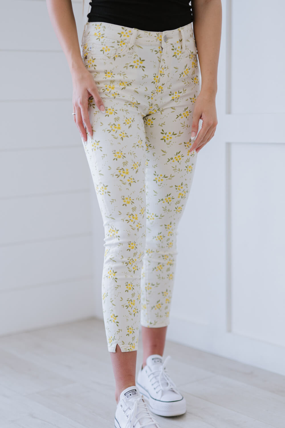 Judy Blue Golden Meadow Floral Skinny Jeans featuring a vibrant yellow floral pattern, mid-rise waist, and a slim fit design.