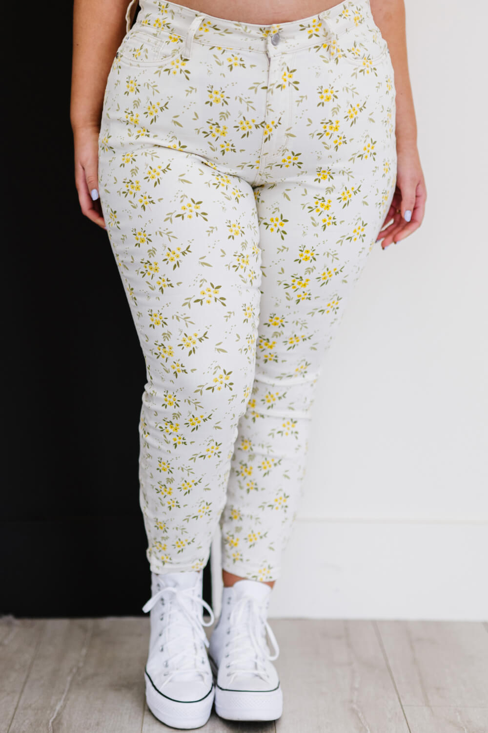 Judy Blue Golden Meadow Floral Skinny Jeans featuring a vibrant yellow floral pattern, mid-rise waist, and a slim fit design.