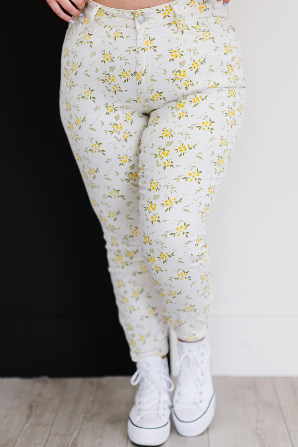 Judy Blue Golden Meadow Floral Skinny Jeans featuring a vibrant yellow floral pattern, mid-rise waist, and a slim fit design.