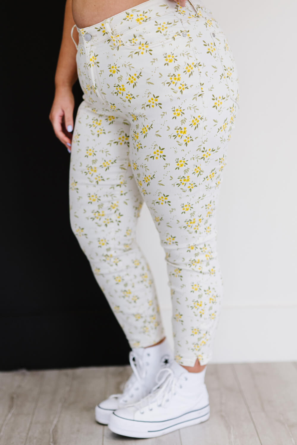 Judy Blue Golden Meadow Floral Skinny Jeans featuring a vibrant yellow floral pattern, mid-rise waist, and a slim fit design.