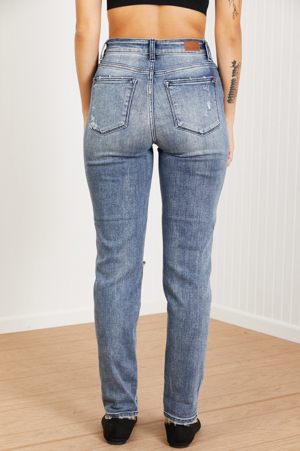 Judy Blue Gracie Mid-Rise Distressed Boyfriend Jeans featuring ripped knees and a classic boyfriend fit.