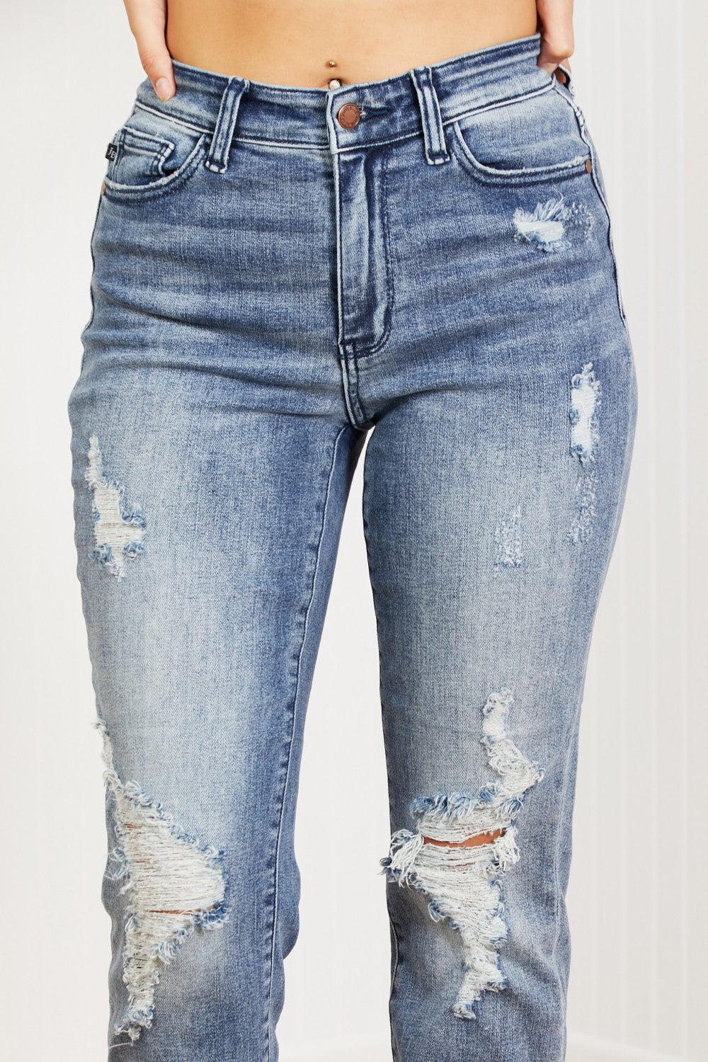 Judy Blue Gracie Mid-Rise Distressed Boyfriend Jeans featuring ripped knees and a classic boyfriend fit.