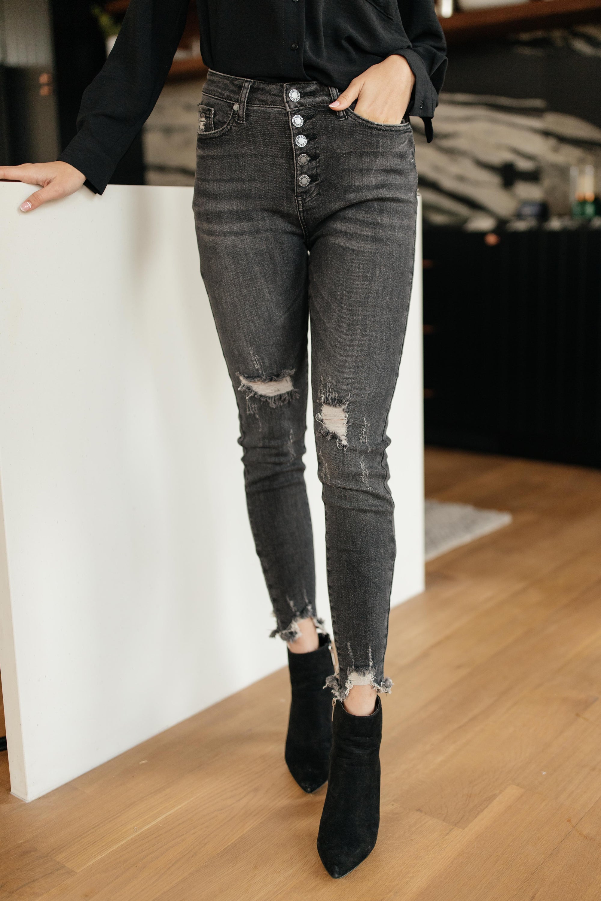 Judy Blue Gray Days Button Rise Jeans featuring a stylish button rise design, distressed detailing at knees, and functional pockets.