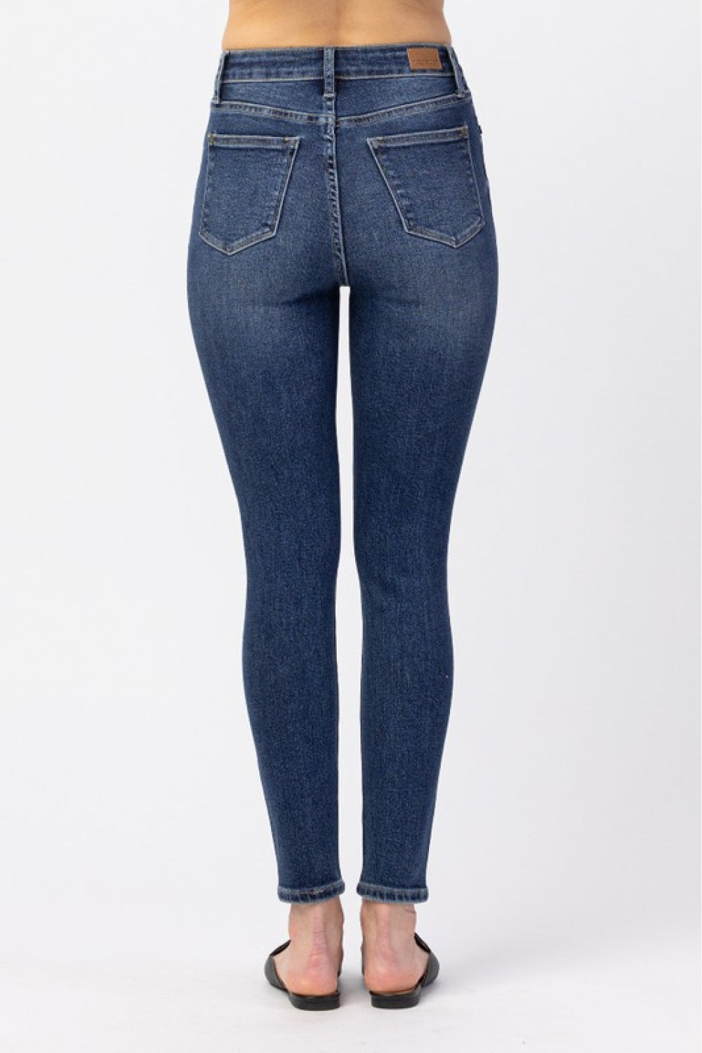 Judy Blue High-Rise Ankle-Length Jeans displayed on a model, showcasing the flattering fit and classic pocket design.