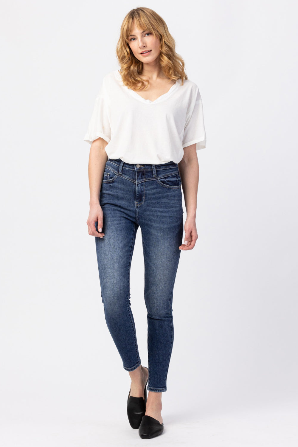 Judy Blue High-Rise Ankle-Length Jeans displayed on a model, showcasing the flattering fit and classic pocket design.