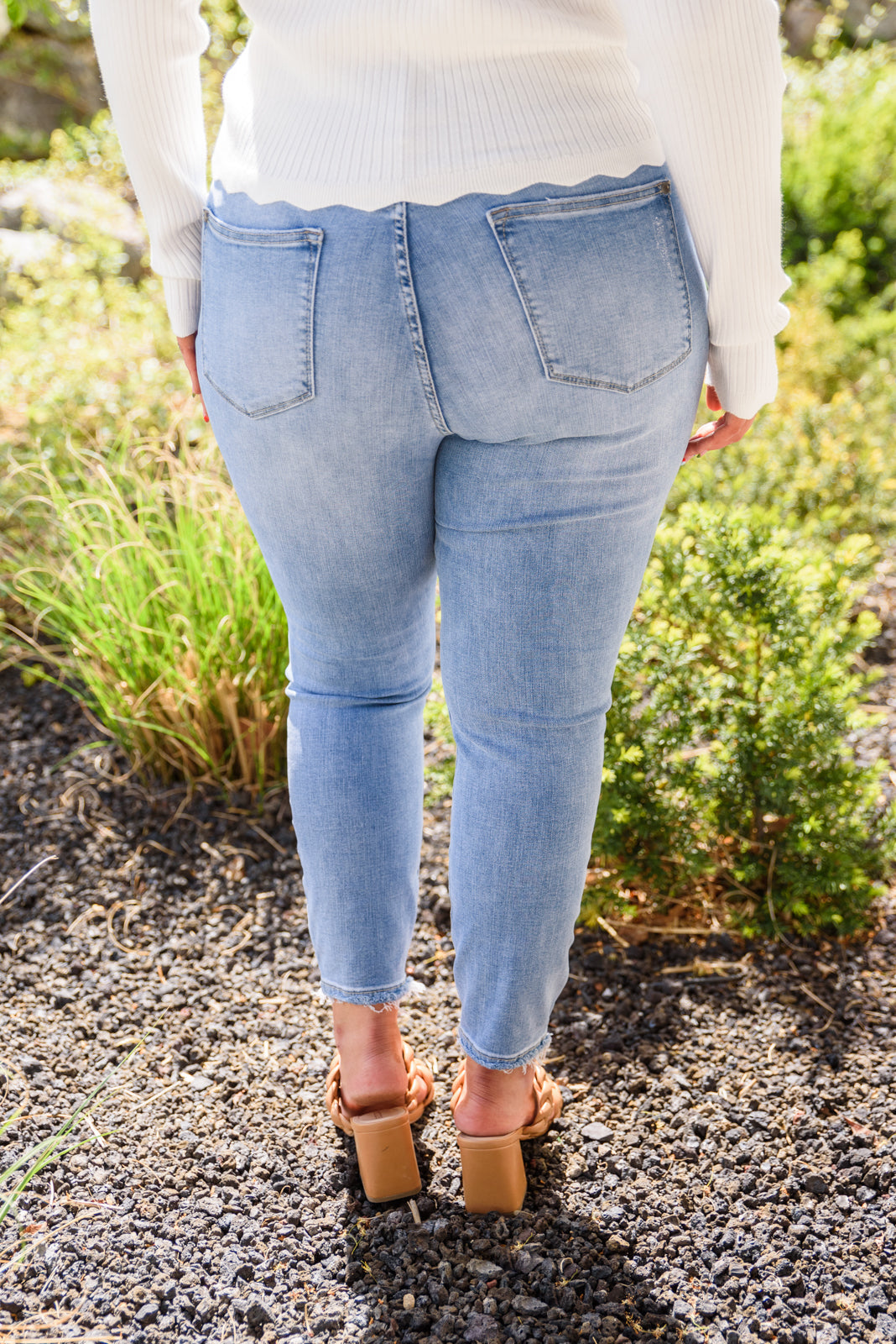 Judy Blue Hi-Rise Button Fly Skinny jeans in light wash, showcasing the button fly and five pocket design.