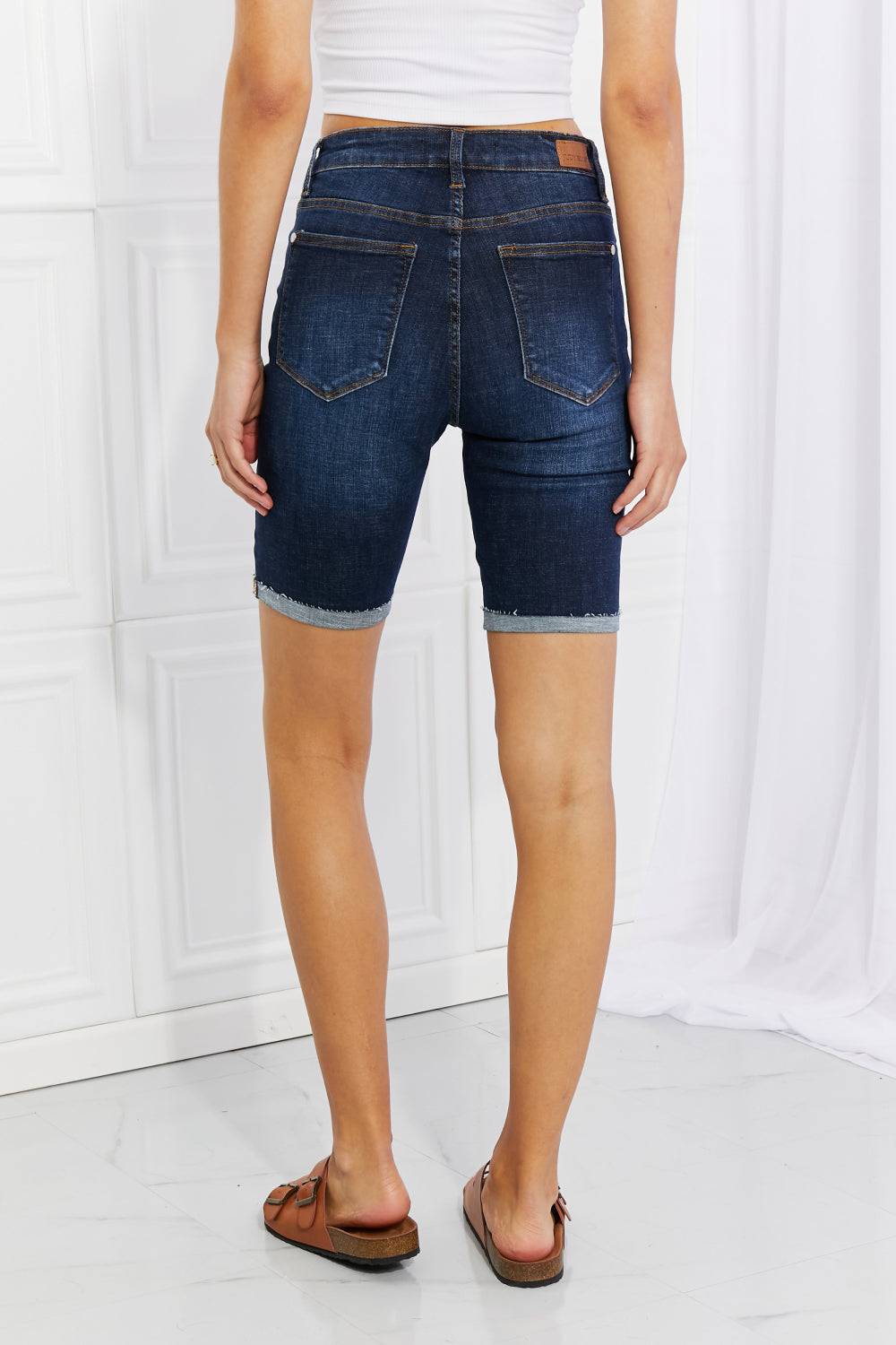 Judy Blue Lucy High Rise Patch Bermuda Shorts featuring a high waist, patched rips, and a comfortable fit, perfect for summer wear.