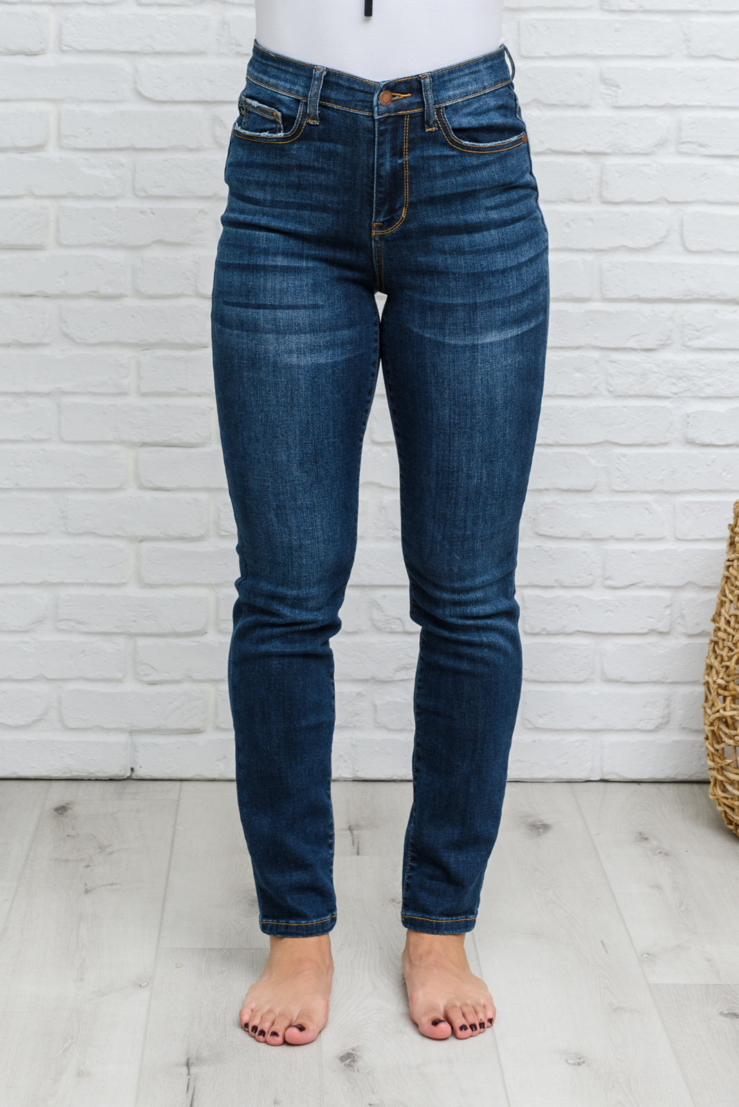 Judy Blue Reba Hi-Rise Clean Relaxed Fit Jeans displayed on a model, showcasing the dark wash denim and relaxed fit.