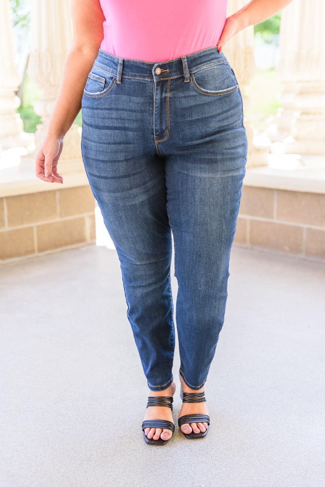 Judy Blue Reba Hi-Rise Clean Relaxed Fit Jeans displayed on a model, showcasing the dark wash denim and relaxed fit.