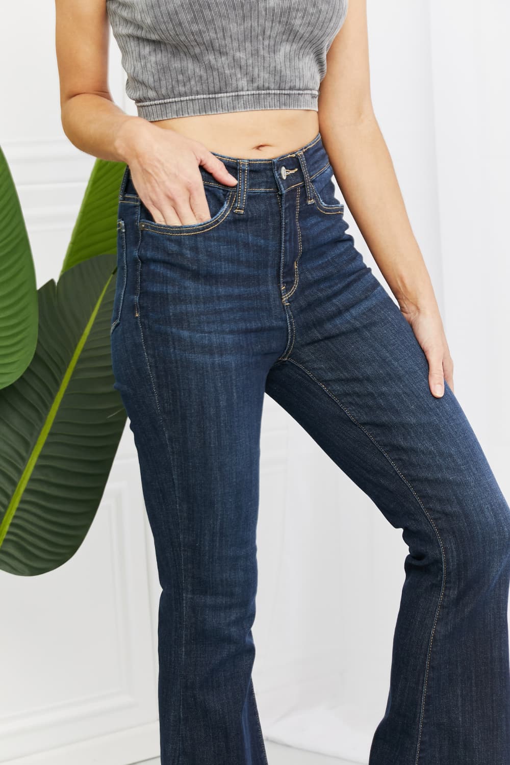 Judy Blue Tiffany Full Size Mid Rise Flare Jeans in dark wash, showcasing the flattering mid-rise waist and flare leg silhouette.