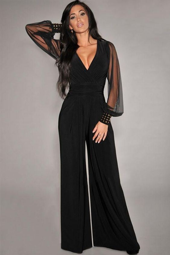 Elegant black jumpsuit with 'V' neckline and translucent long sleeves, featuring fashionable wrist accessories.