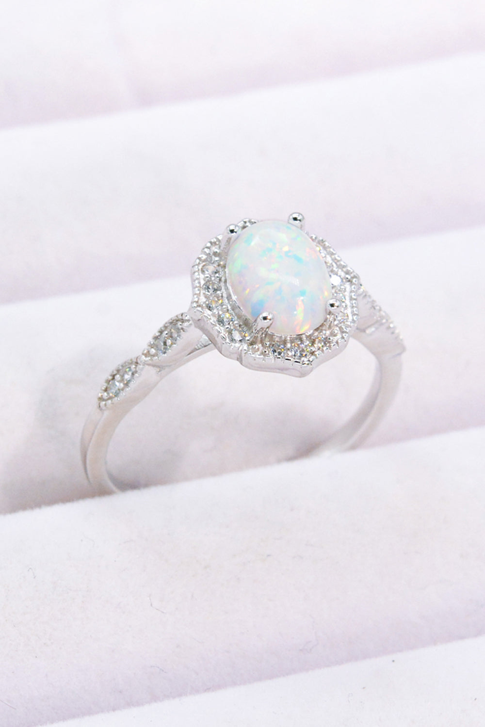 Just For You 925 Sterling Silver Opal Ring displayed in a flat lay style, showcasing its minimalist design and vibrant opal gemstone.