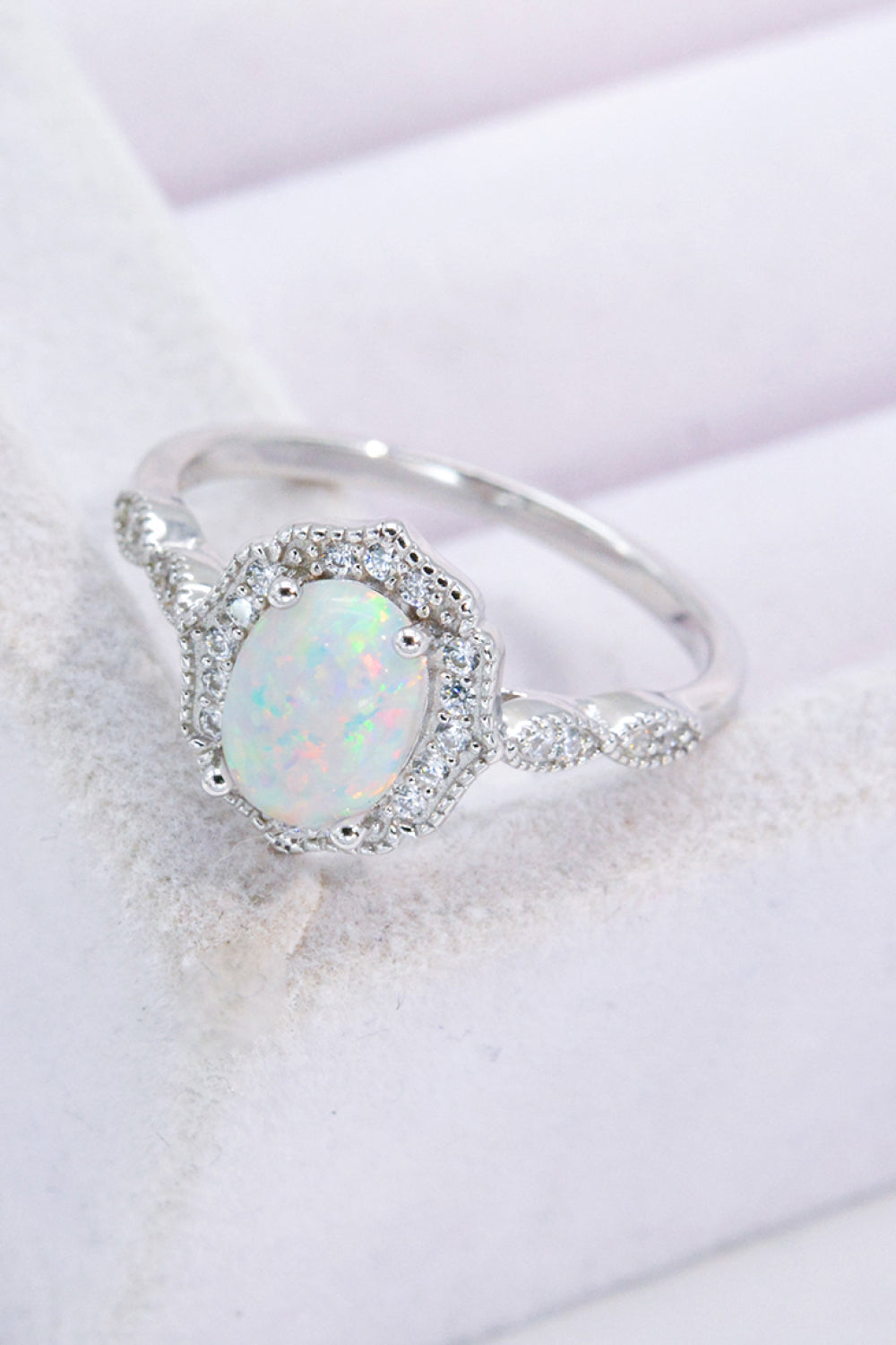 Just For You 925 Sterling Silver Opal Ring displayed in a flat lay style, showcasing its minimalist design and vibrant opal gemstone.