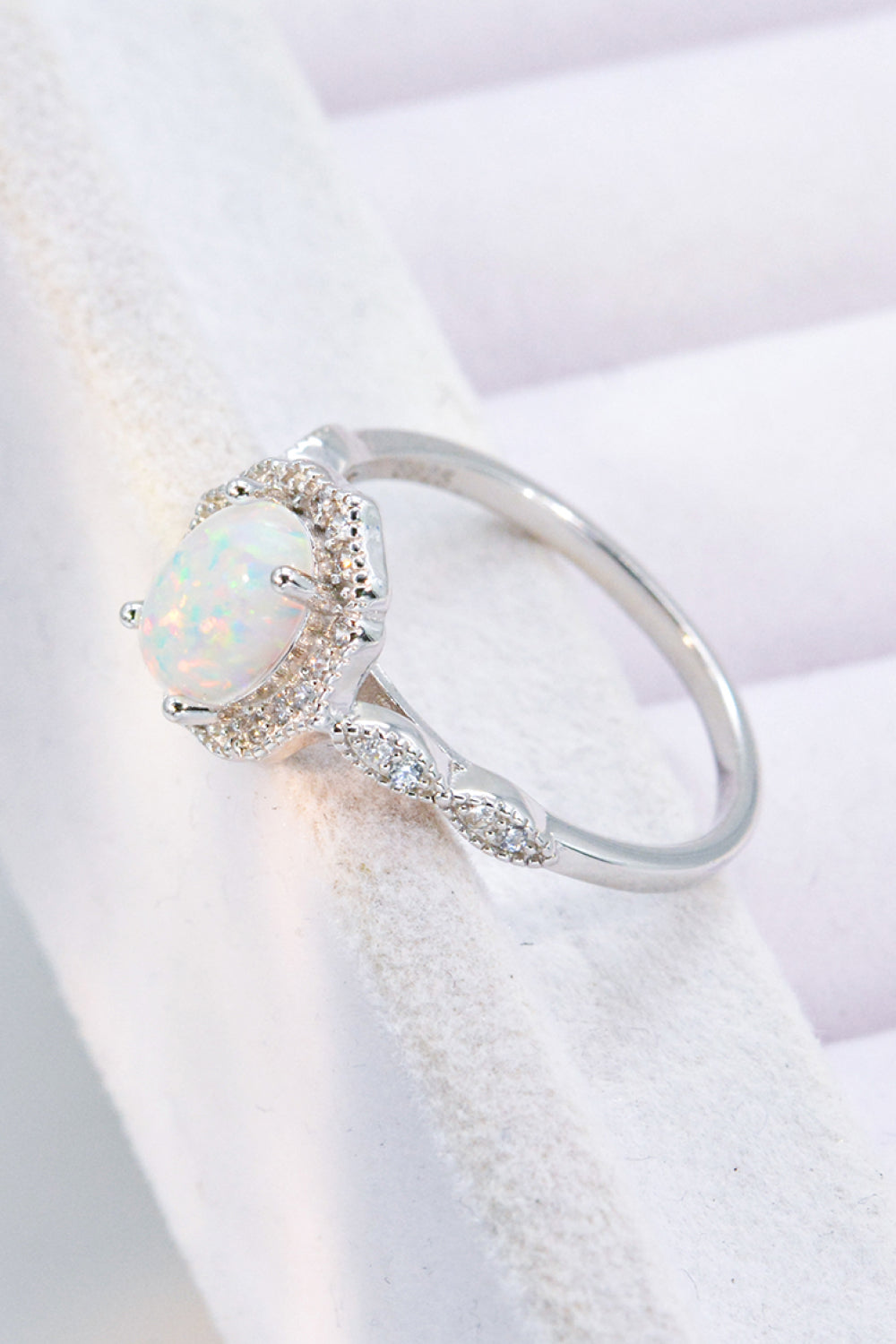 Just For You 925 Sterling Silver Opal Ring displayed in a flat lay style, showcasing its minimalist design and vibrant opal gemstone.