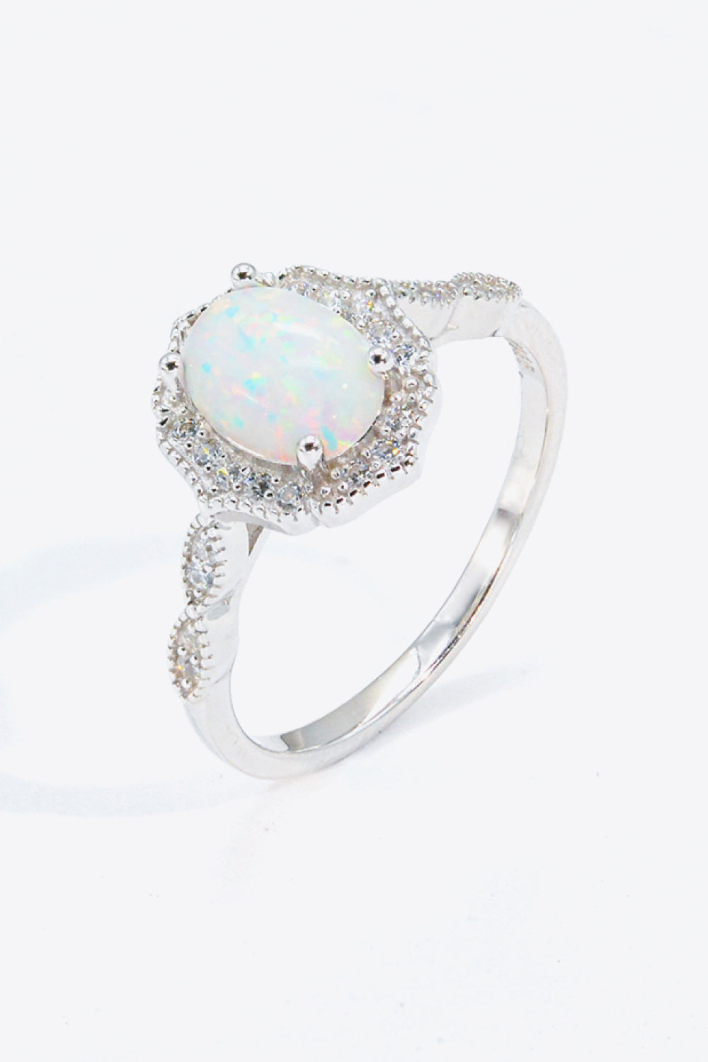 Just For You 925 Sterling Silver Opal Ring displayed in a flat lay style, showcasing its minimalist design and vibrant opal gemstone.