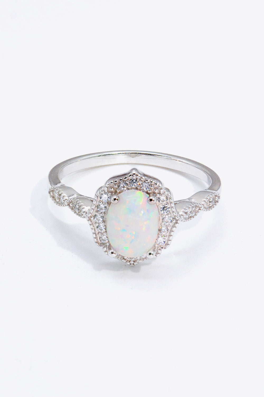 Just For You 925 Sterling Silver Opal Ring displayed in a flat lay style, showcasing its minimalist design and vibrant opal gemstone.