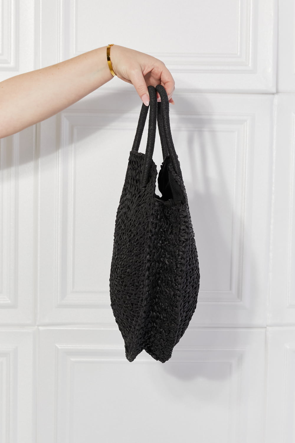 Justin Taylor Beach Date Straw Rattan Handbag in Black, handwoven with 100% paper, featuring a large size and stylish solid black design.