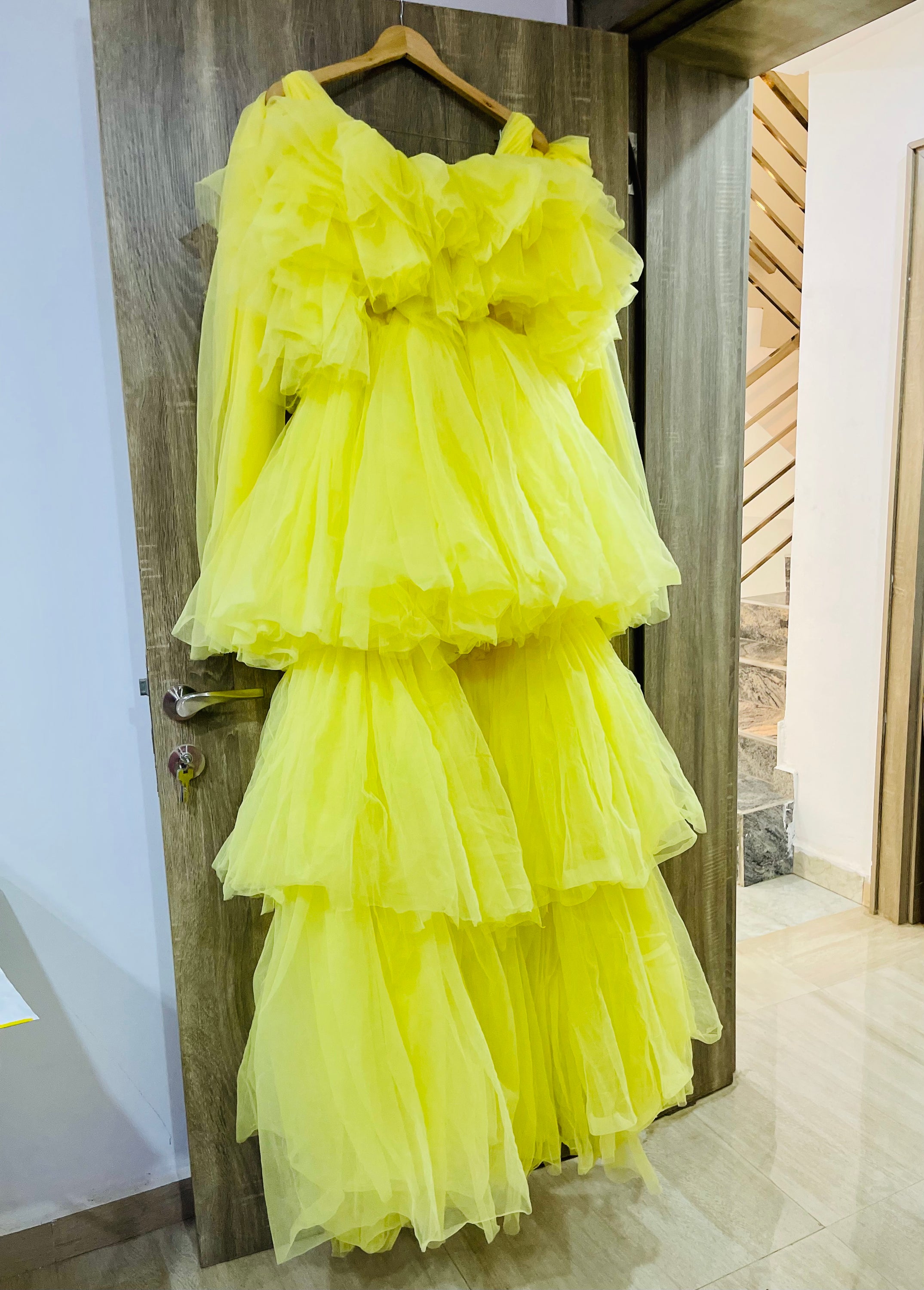 A stunning Kamila Dress made of tulle, showcasing its unique design and vibrant color options.