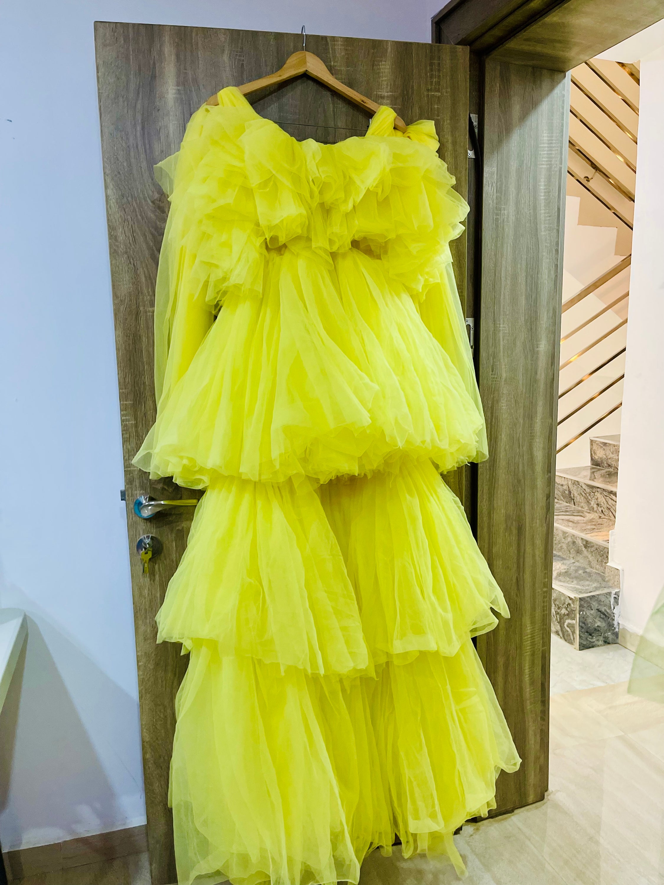 A stunning Kamila Dress made of tulle, showcasing its unique design and vibrant color options.