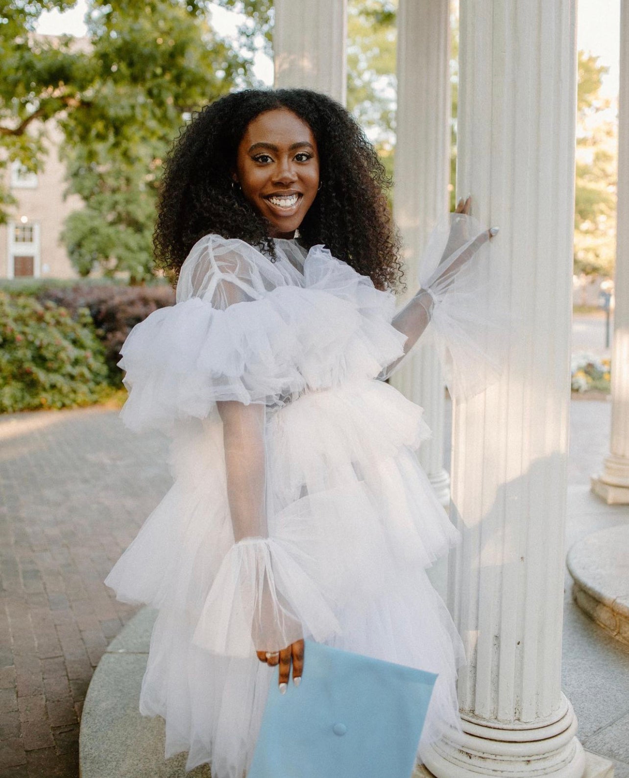 The Kayla Dress featuring soft fluffy ruffles and a zipper back, made from high-quality tulle, perfect for various occasions.