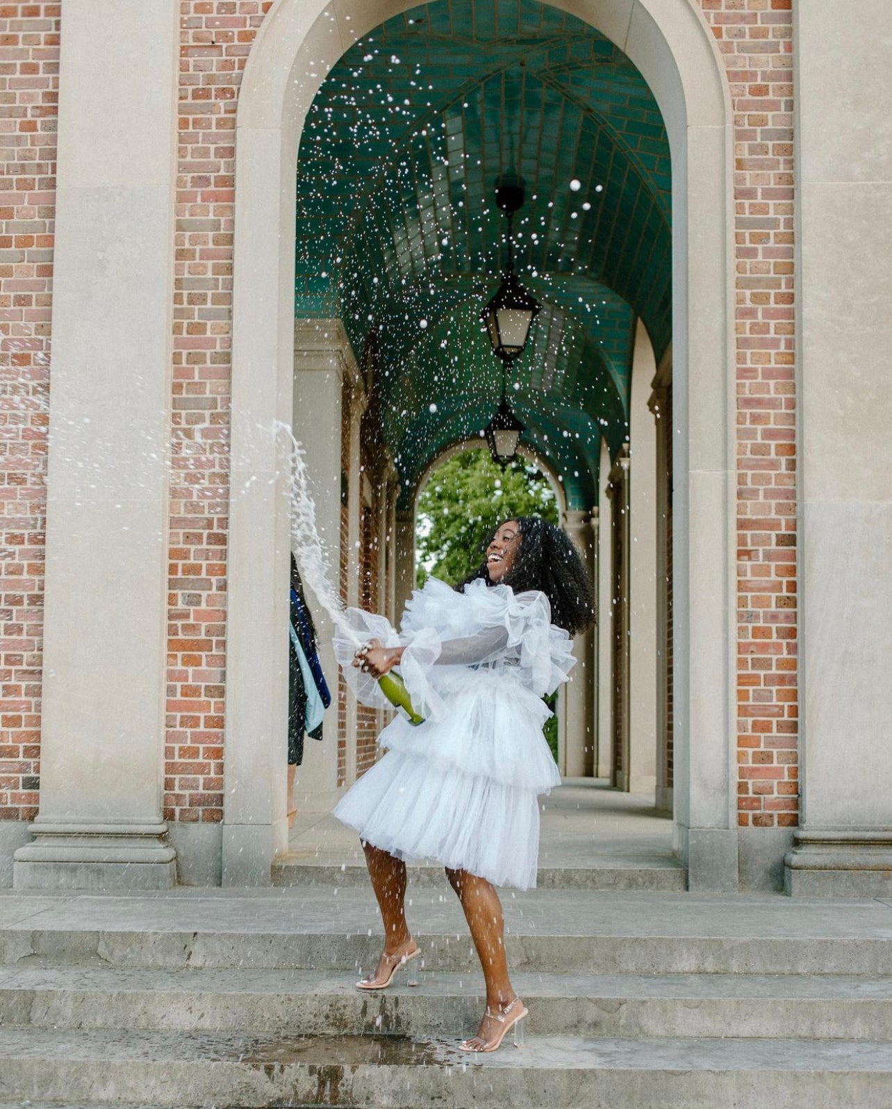 The Kayla Dress featuring soft fluffy ruffles and a zipper back, made from high-quality tulle, perfect for various occasions.