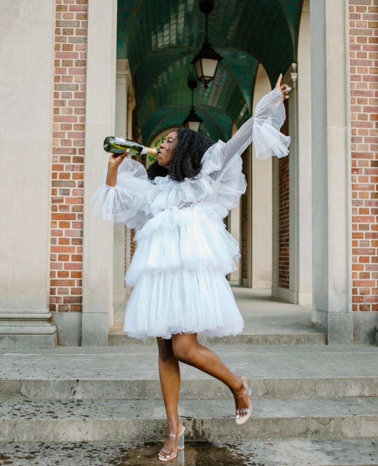 The Kayla Dress featuring soft fluffy ruffles and a zipper back, made from high-quality tulle, perfect for various occasions.