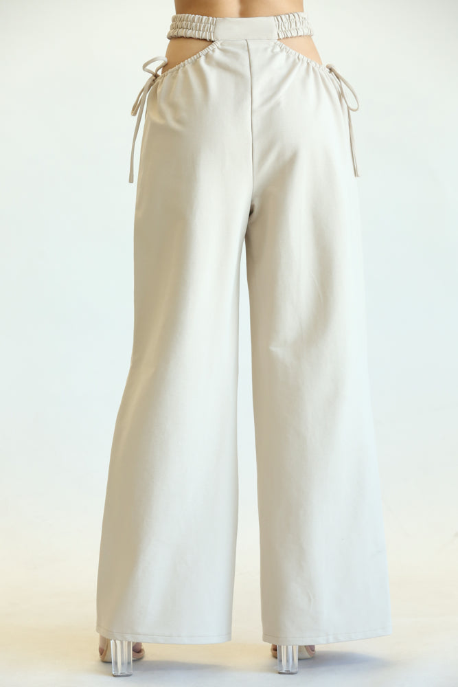 Kelly High Waisted Cut Out Pants featuring side cutouts and a wide-leg fit, made from a soft cotton blend fabric.