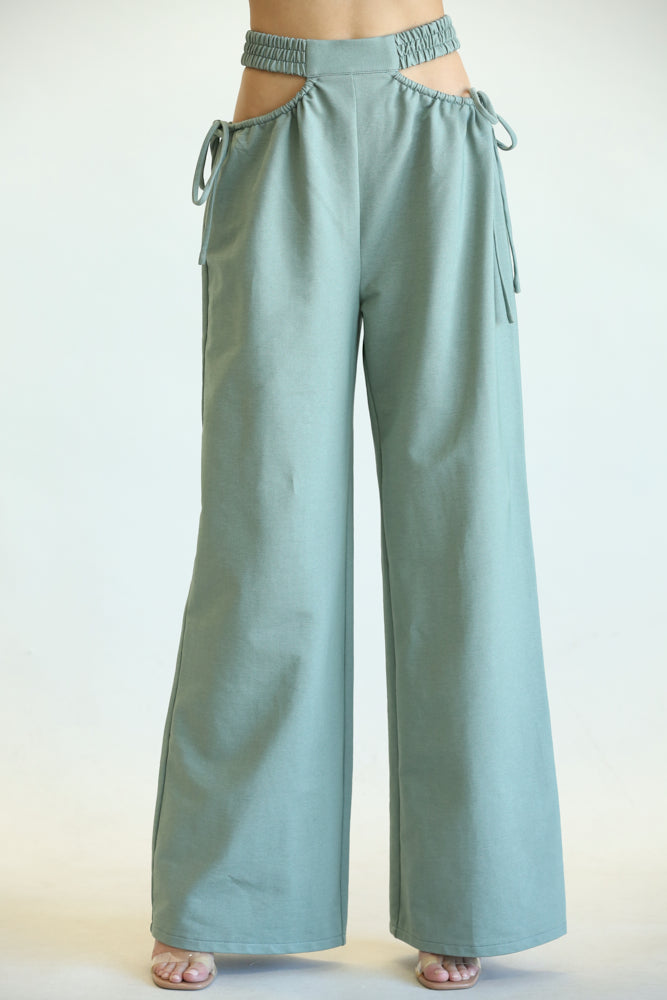 Kelly High Waisted Cut Out Pants featuring side cutouts and a wide-leg fit, made from a soft cotton blend fabric.