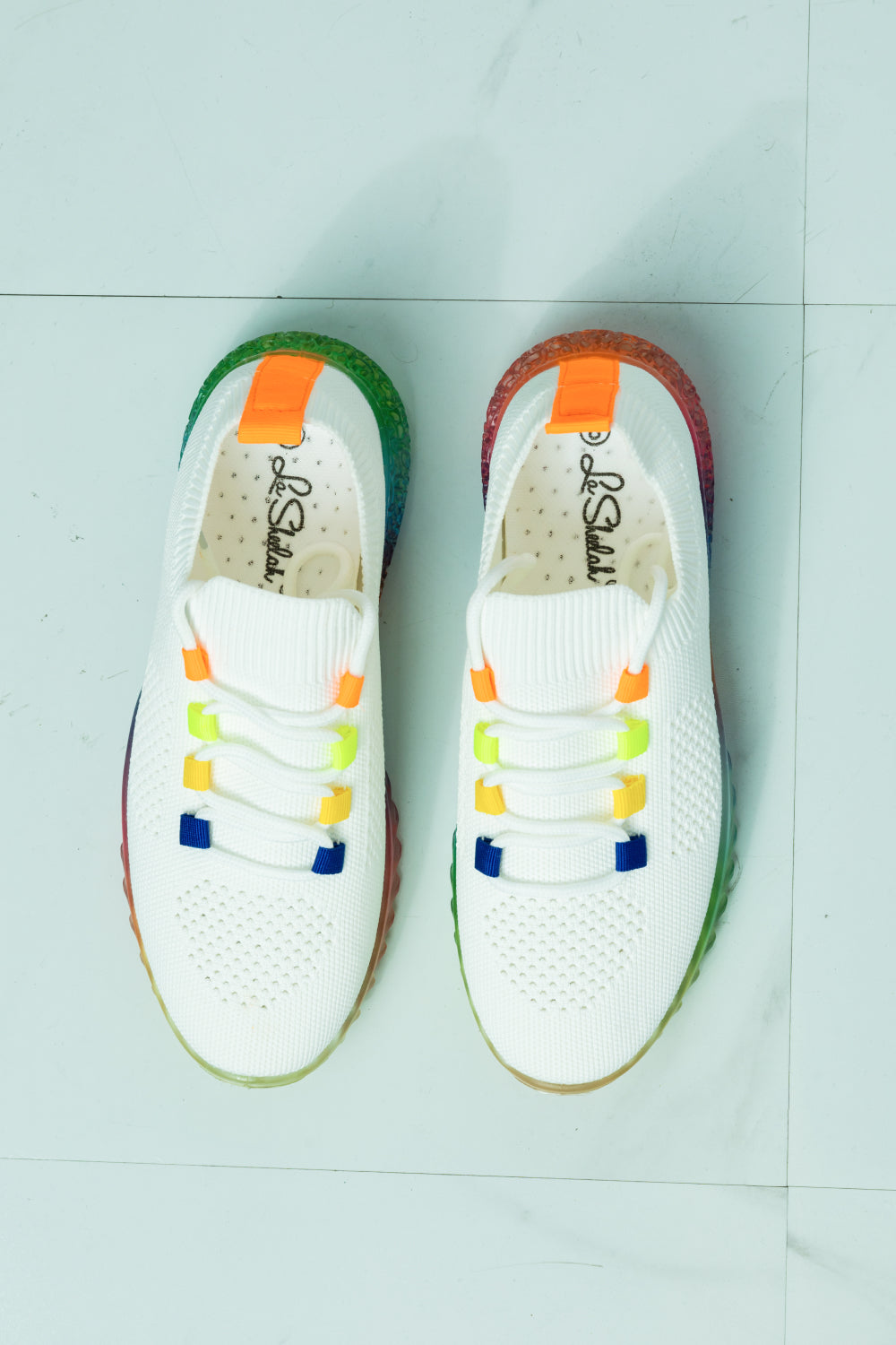 Colorful Kick It To The Limit Rainbow Sole Sneaker with a vibrant rainbow sole and fabric upper, designed for comfort and style.