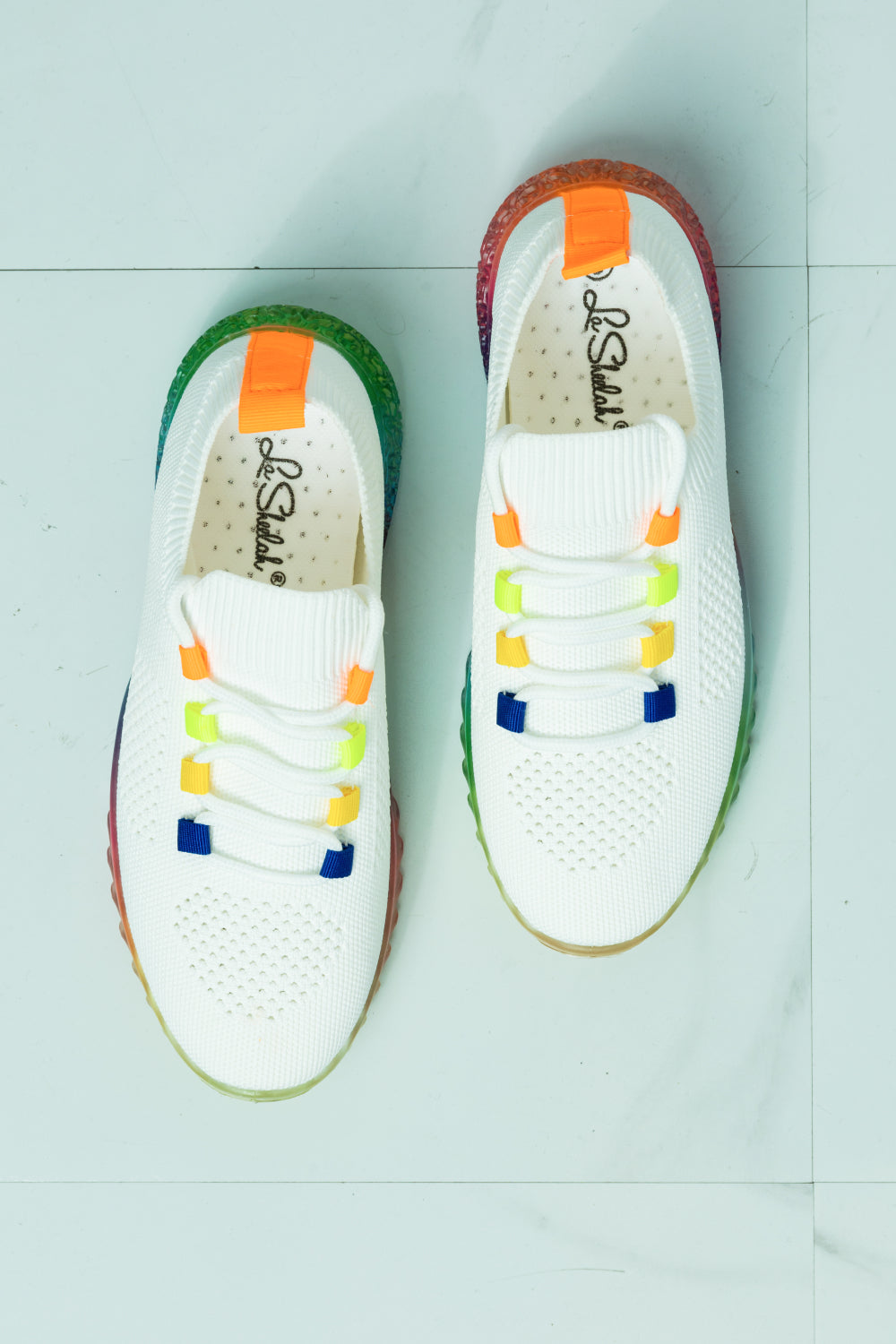 Colorful Kick It To The Limit Rainbow Sole Sneaker with a vibrant rainbow sole and fabric upper, designed for comfort and style.