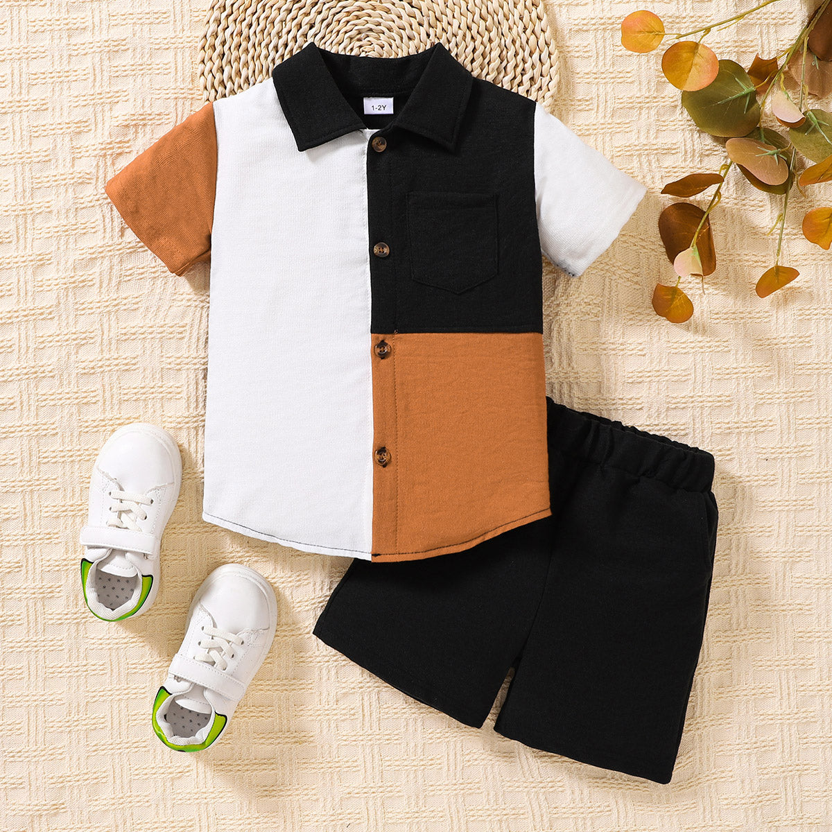 A vibrant kids color block shirt and shorts set featuring a collared neck and short sleeves, perfect for casual wear.