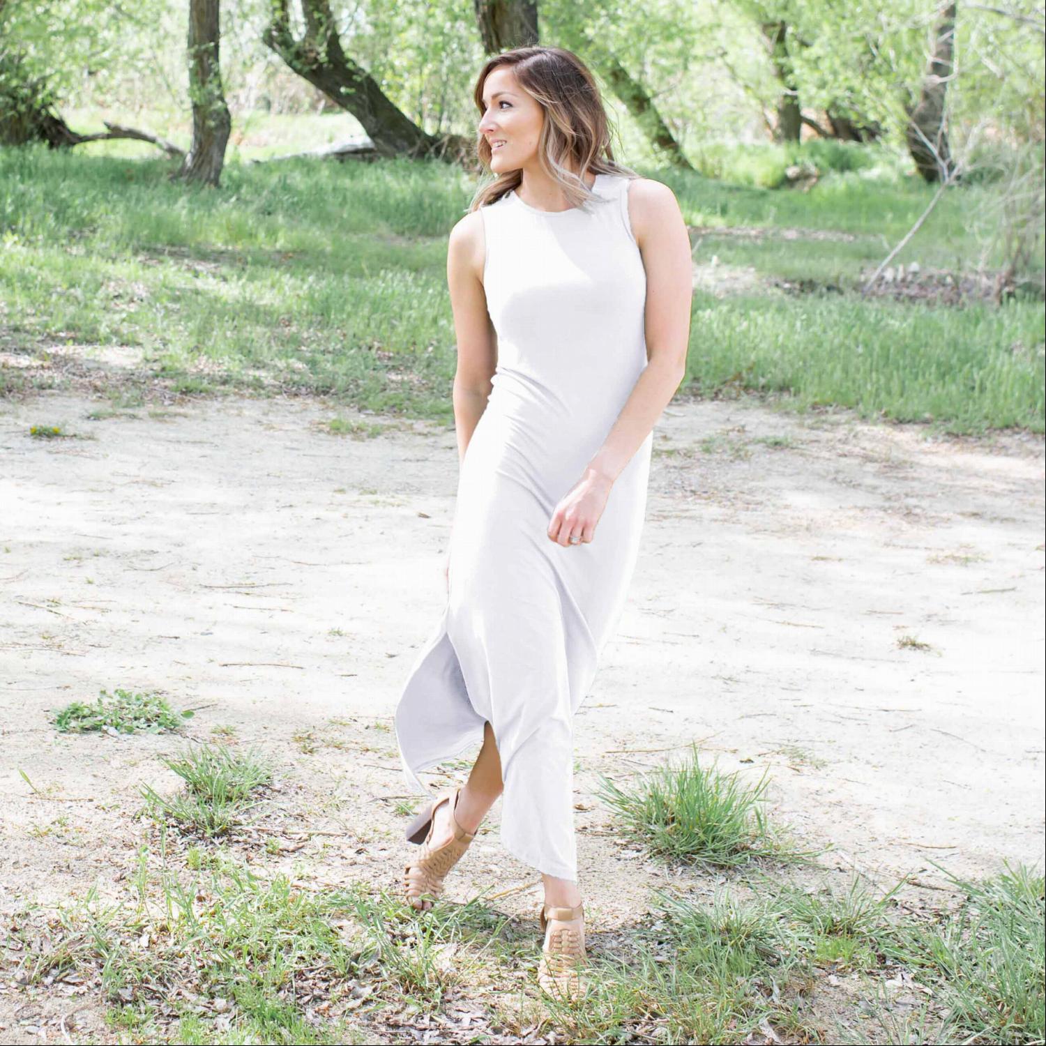 A stylish Knit Maxi Dress featuring double side slits, sleeveless design, and a form-fitting silhouette, perfect for summer outings.