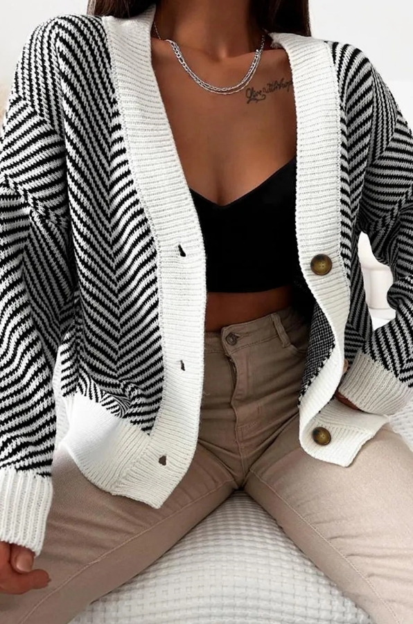 Black knitted cardigan featuring a stylish striped print, long sleeves, and front button closure.