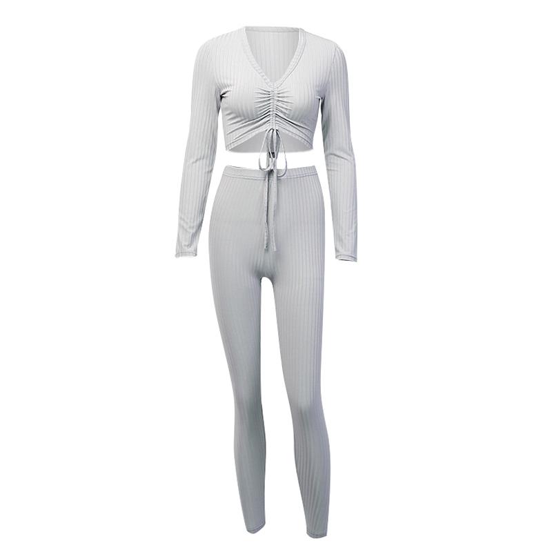 A stylish gray knitted long sleeve jumpsuit for women featuring a lace-up design, perfect for clubbing and casual outings.