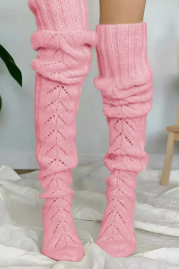 A pair of pink knitted over the knee socks featuring a fishbone pattern, designed for women's comfort and style.