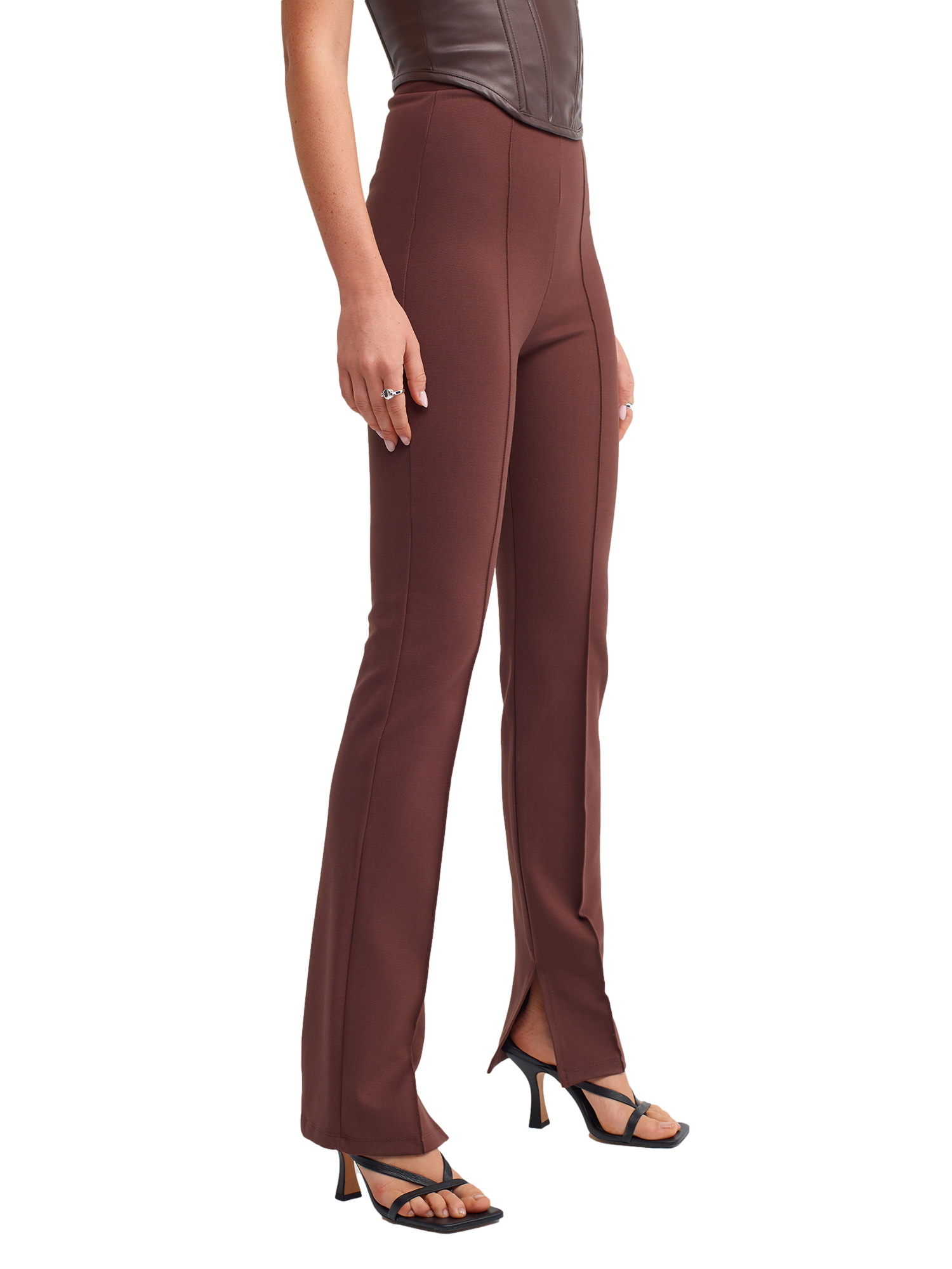 A pair of stylish knitted trousers featuring a slit detail, showcasing a soft fabric blend of viscose, nylon, and elastane.